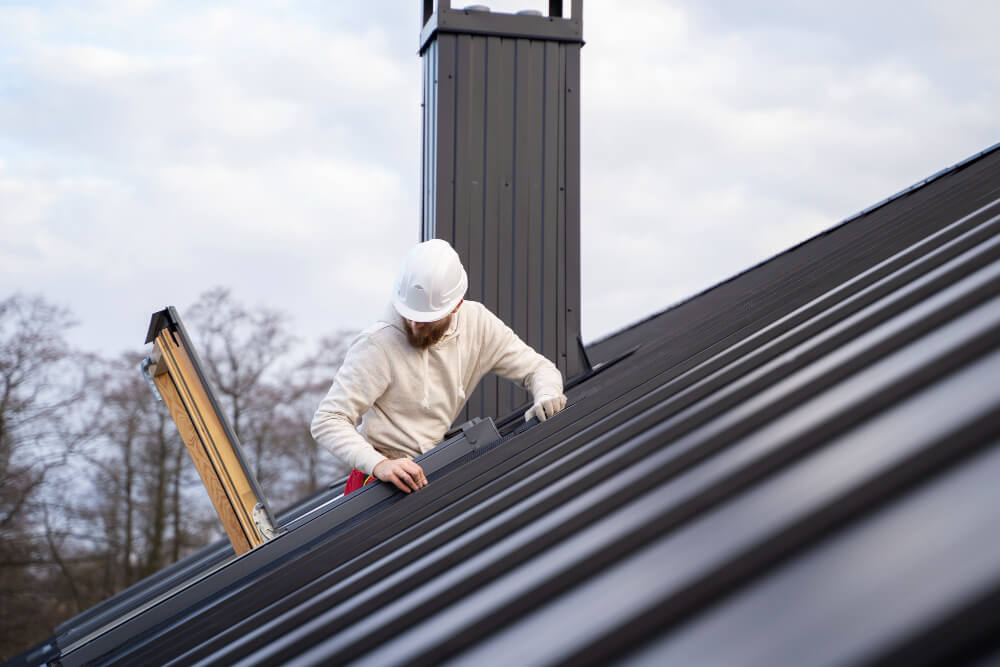 worker on steel roof